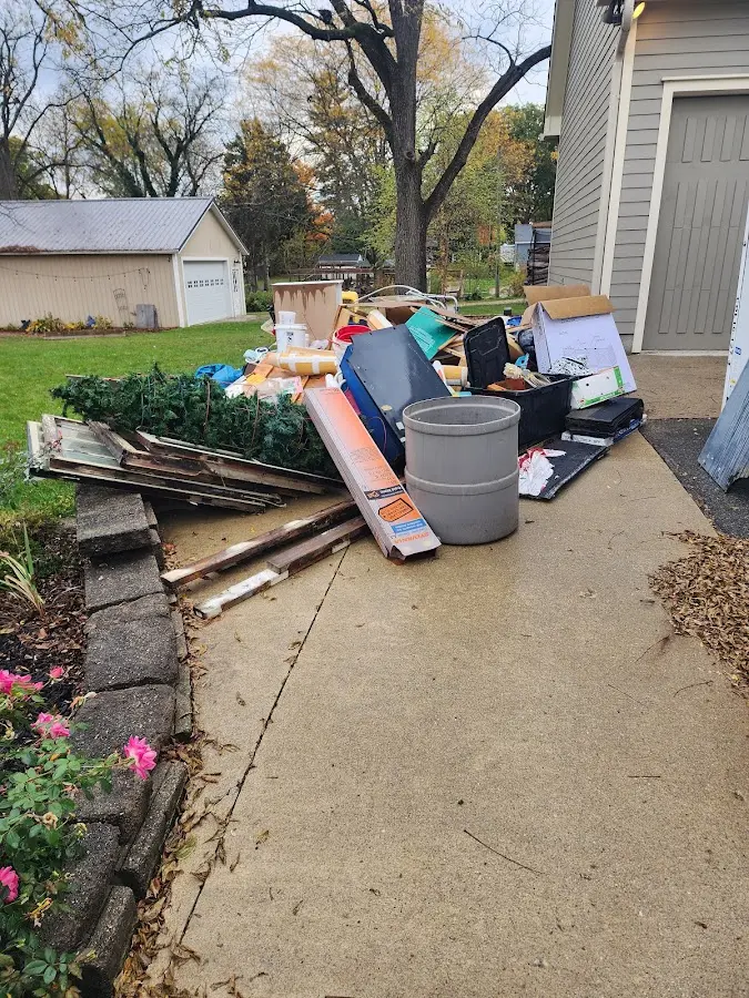 Dumpster being loaded with debris for 3 Yard Dumpster Rental in Lake Oswego